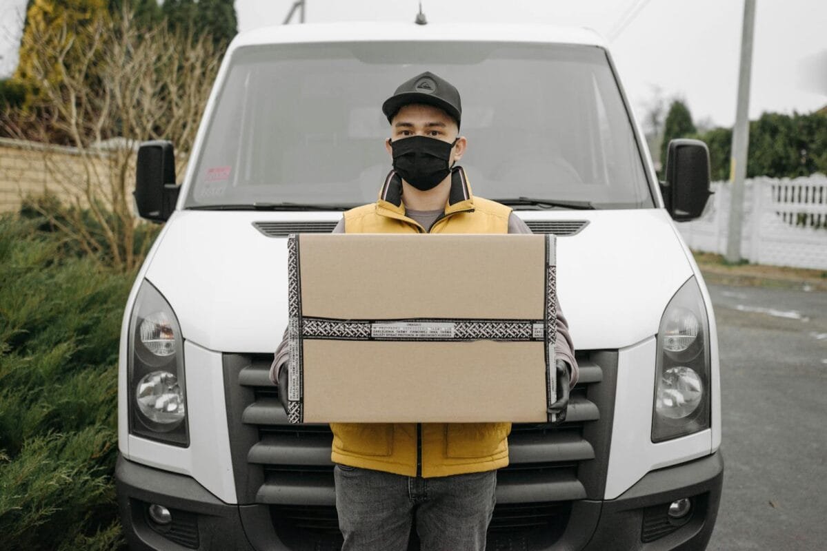 Man Carrying a Shipping Box